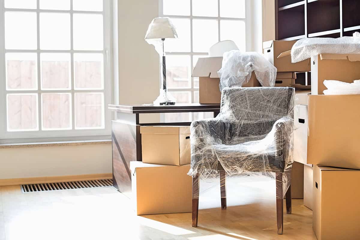 Movers relocating office equipment