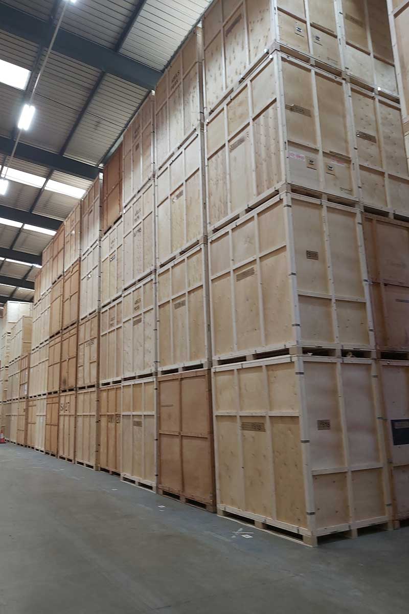 Storage containers being managed by forklift